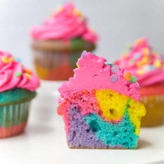 Rainbow Marbled Cupcakes are so impressive yet so EASY to make! Perfect for a rainbow or unicorn party!