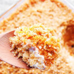 sweet potato casserole on a wooden spoon.