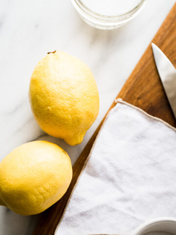 lemons and salt on a table.