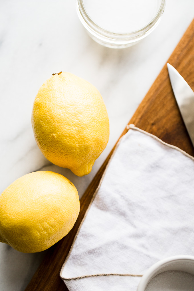 Lemons and salt on a table.