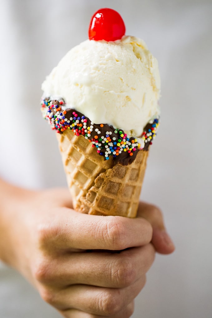 Homemade No-Churn Vanilla Ice Cream on a waffle cone.