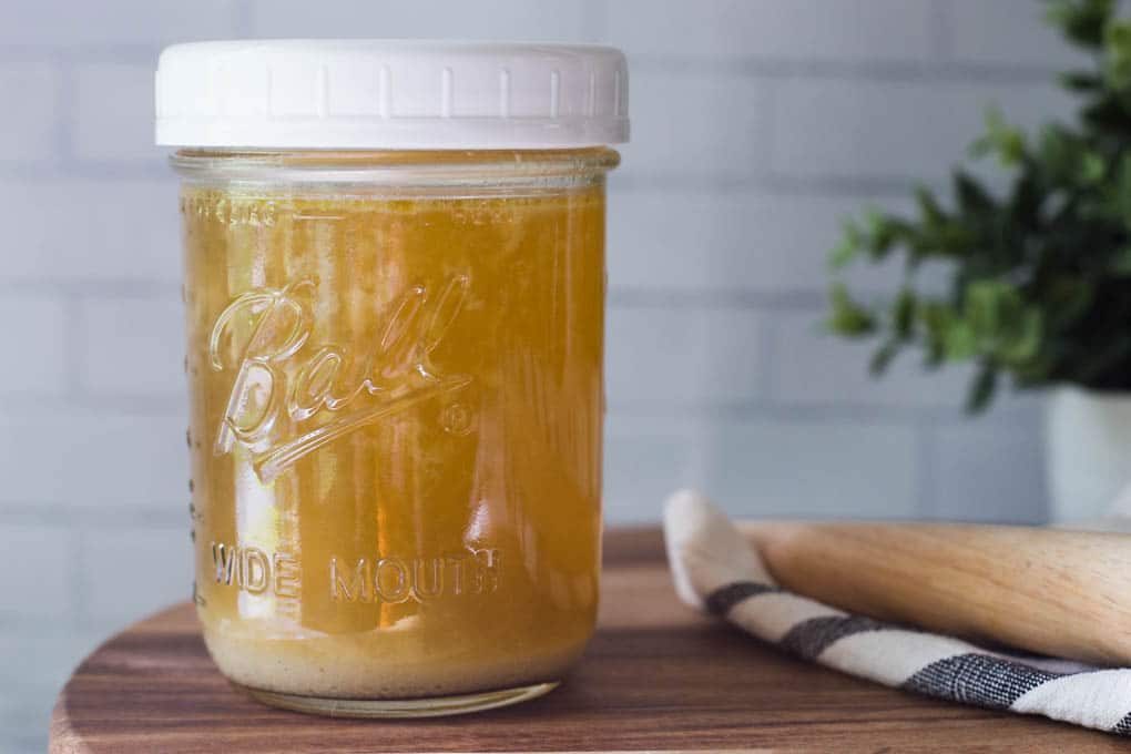 Chicken stock in a mason jar.