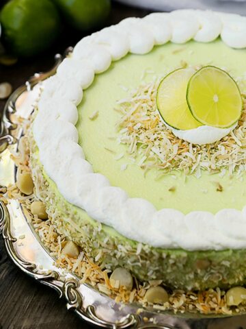 key lime cheesecake with whipped cream and toasted coconut