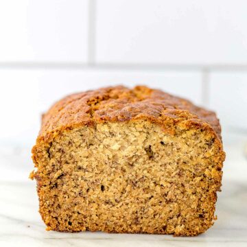 a loaf of banana bread with a slice cut out