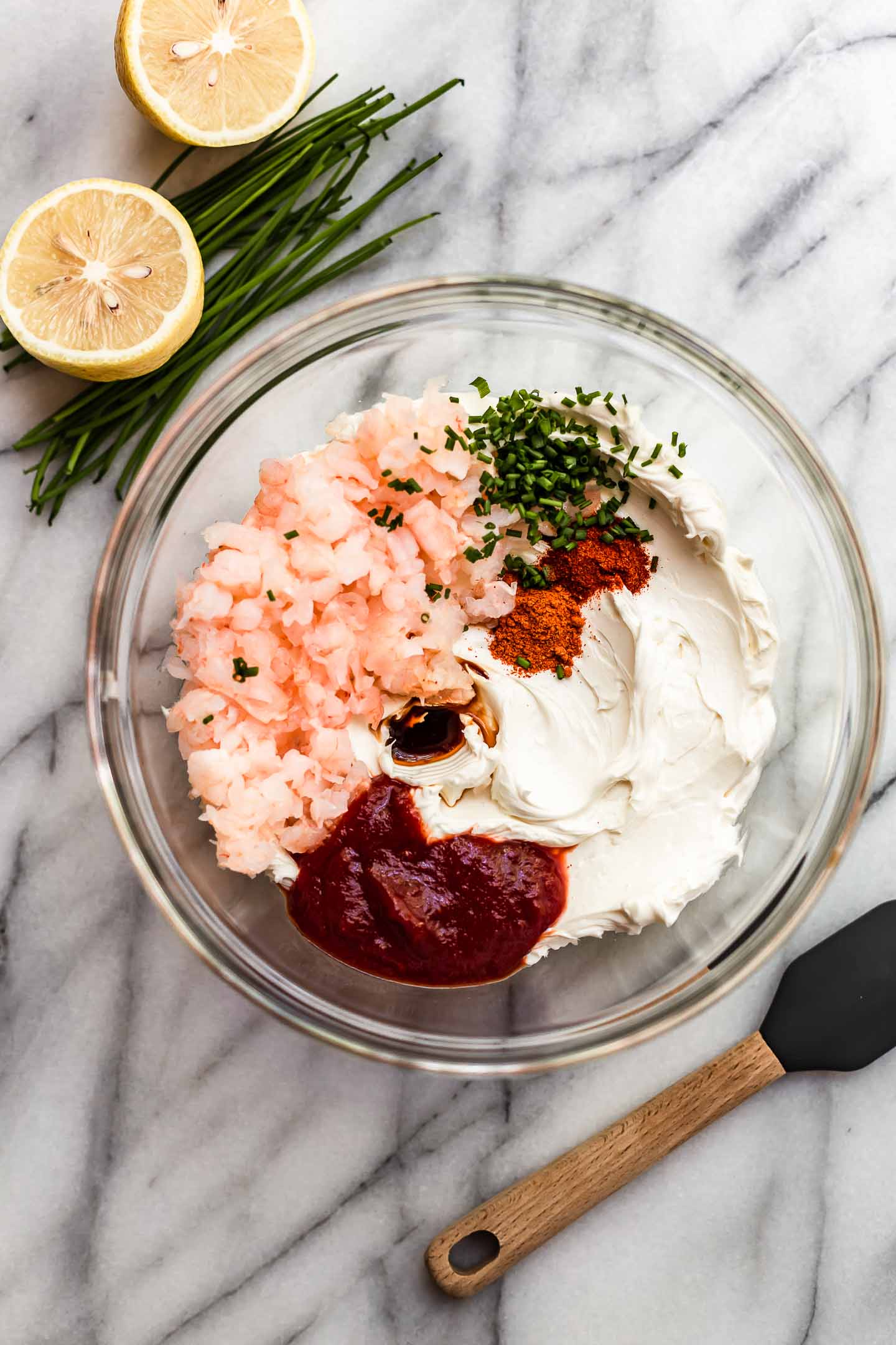 Pink shrimp dip ingredients in a bowl.
