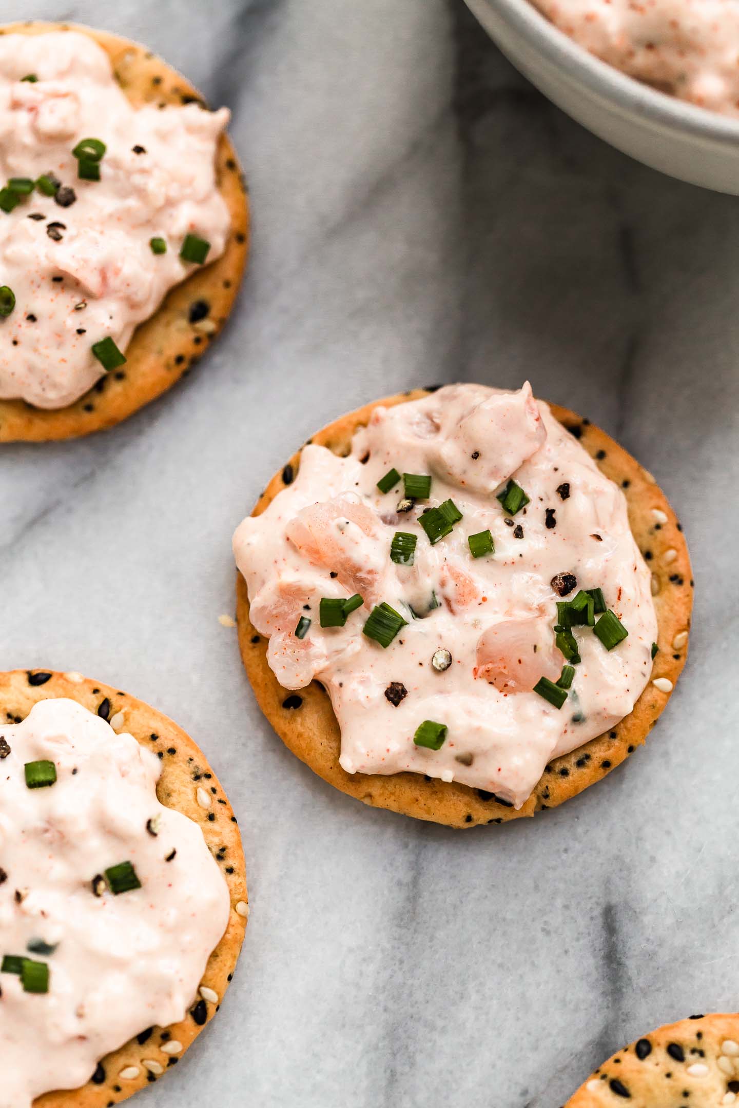 pink shrimp dip on crackers.