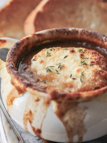 French onion soup with melted cheese in a bowl.