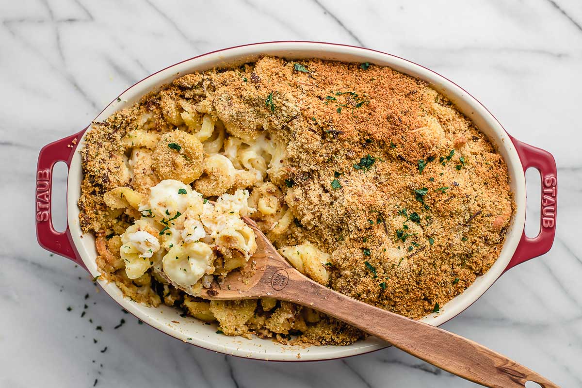 Baked casserole dish of lobster mac and cheese.