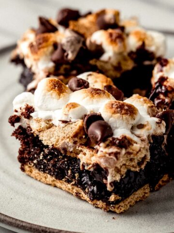 Baked smores browinies on a plate.