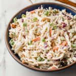 Coleslaw in a blue bowl.