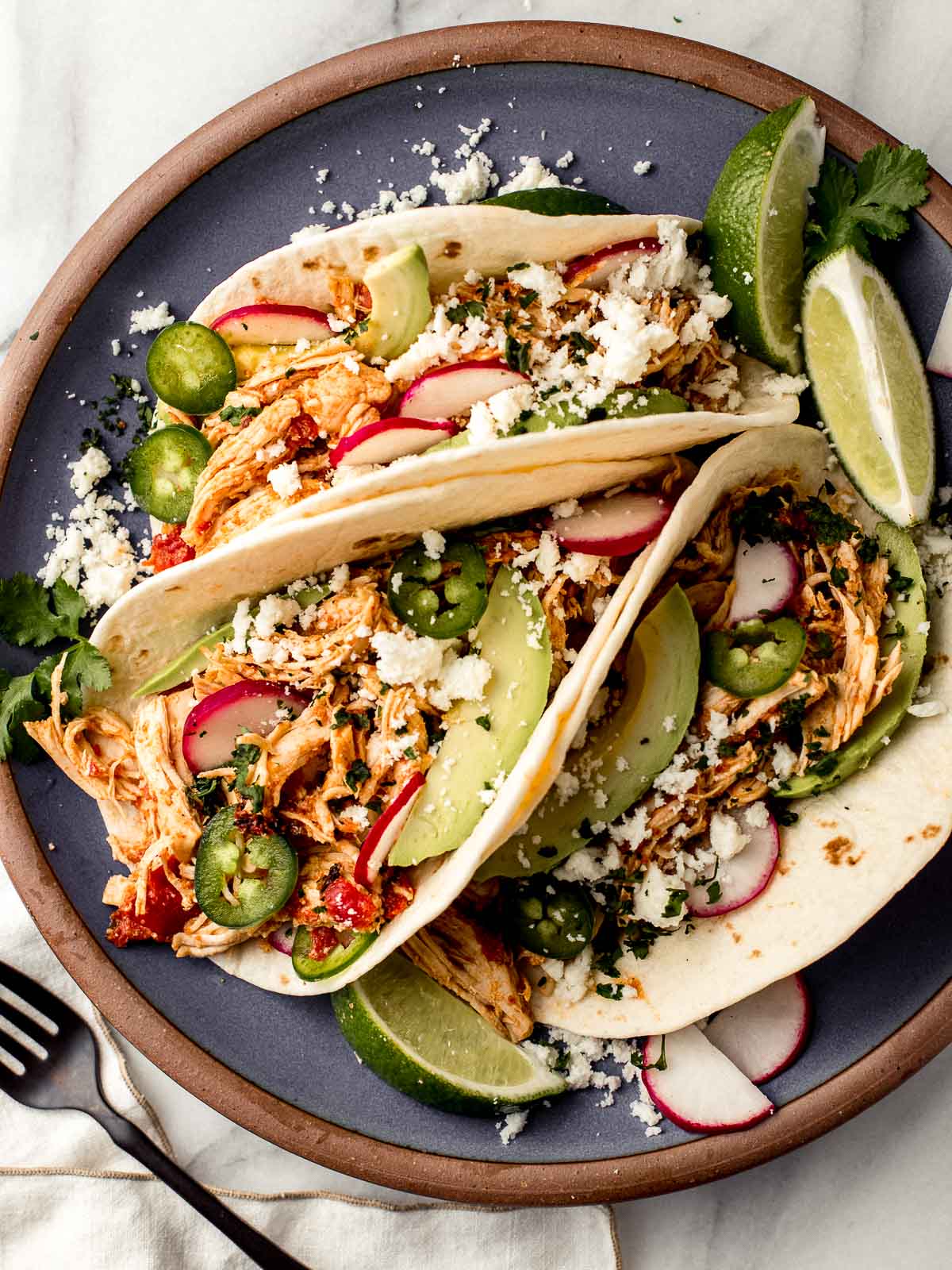 Chicken tacos on a plate.