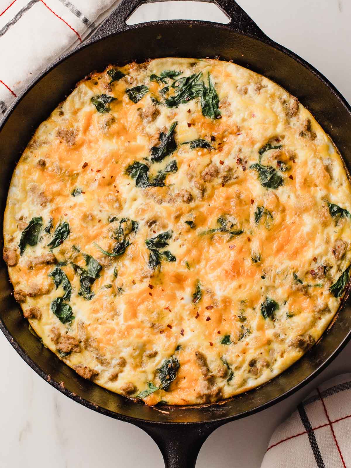 Turkey Sausage Spinach Frittata in a cast iron skillet.