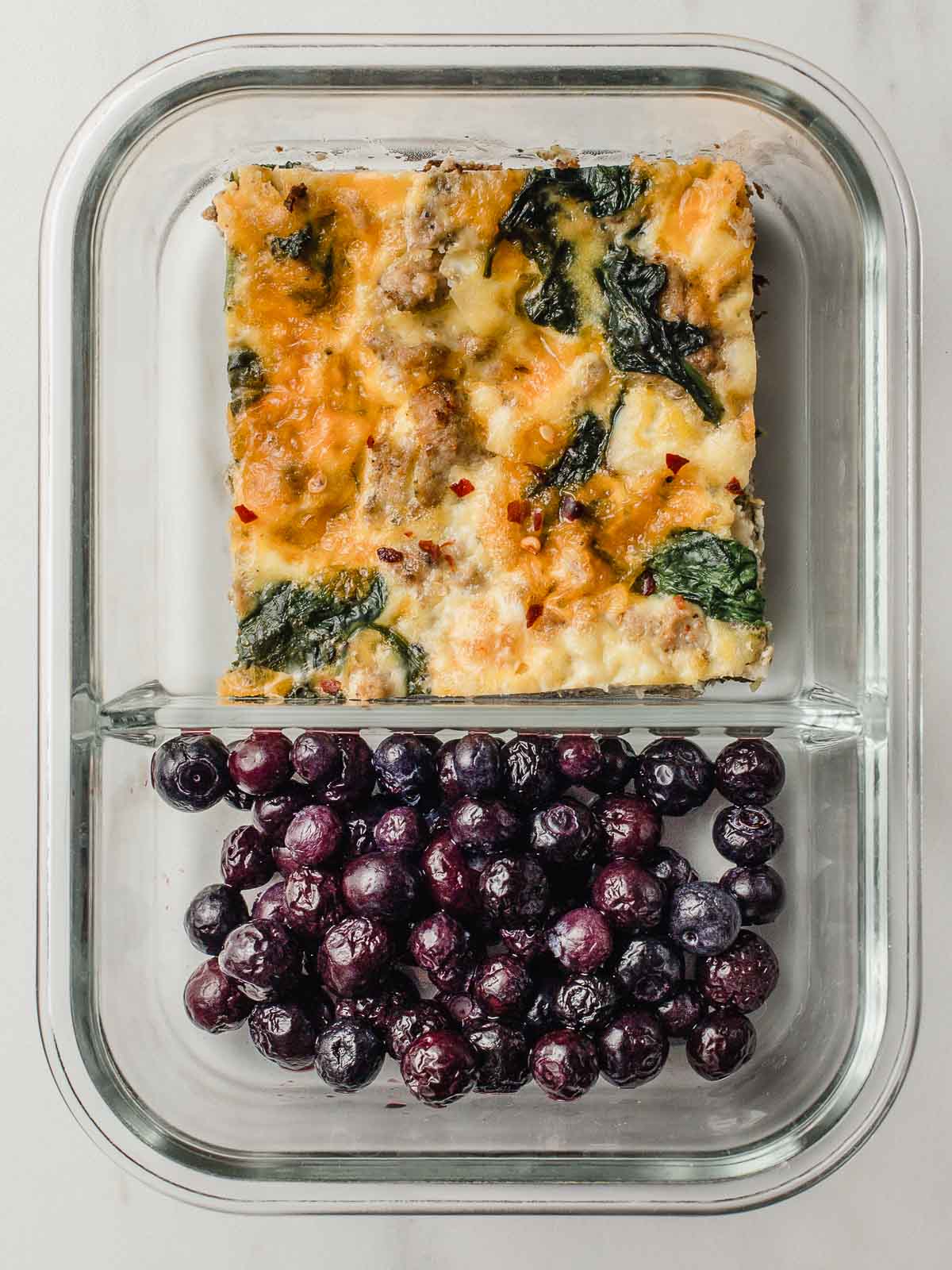 Turkey sausage and spinach frittata blueberries meal prep bowl.