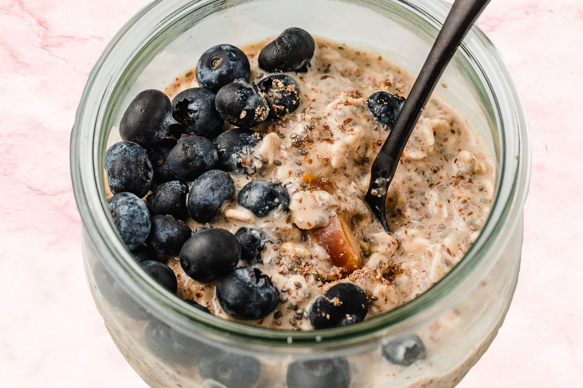 Blueberry overnight oats with dates in a jar.