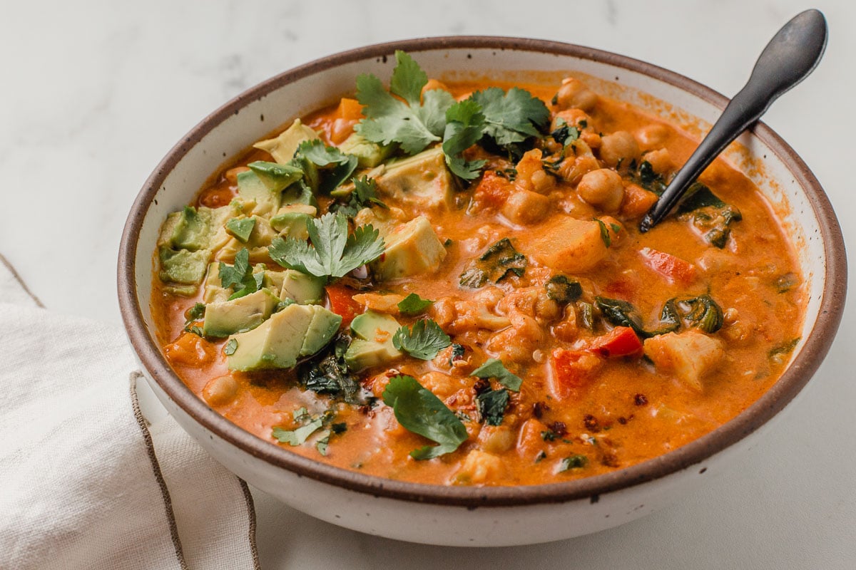 Chickpea cauliflower curry with avocado and cilantro.