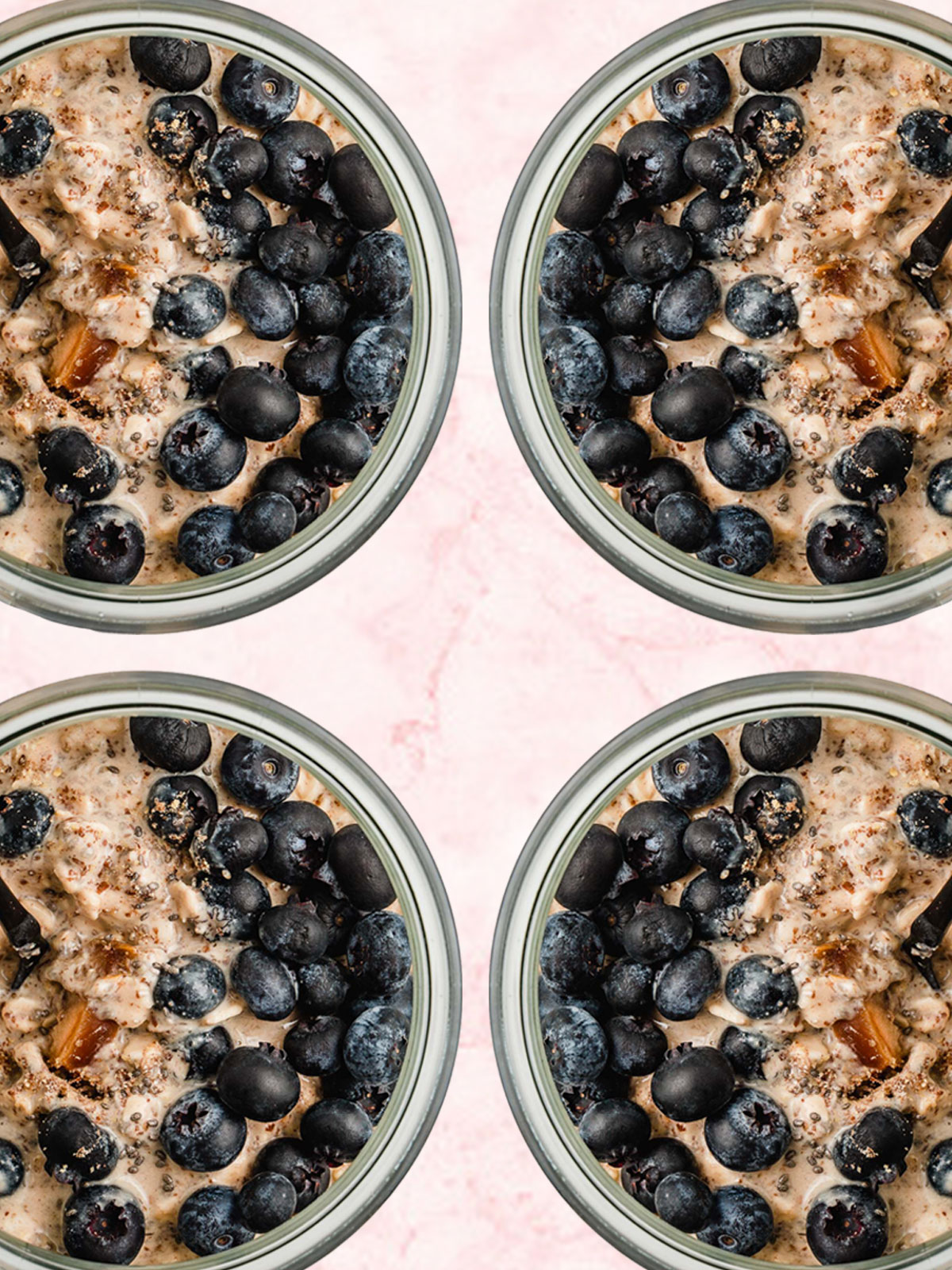 Four jars of blueberry overnight oats on a table.