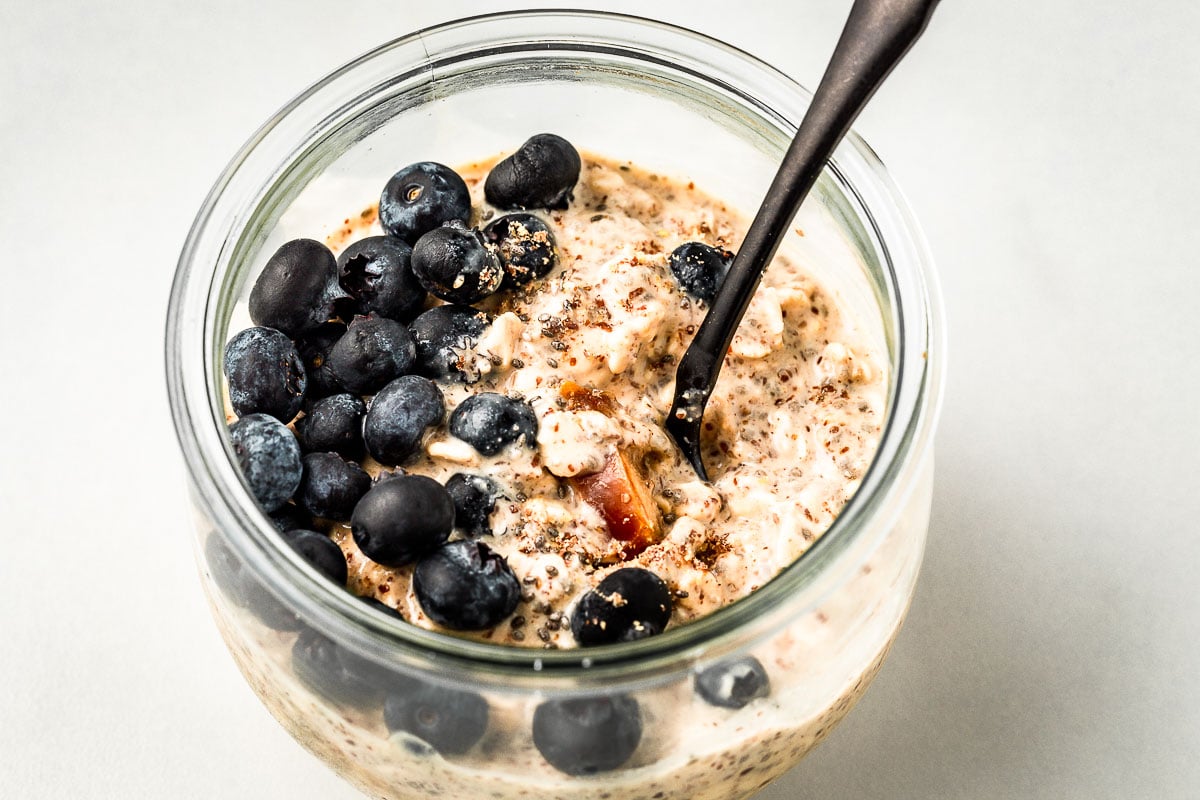 Protein Overnight Oats with blueberries walnuts and dates.